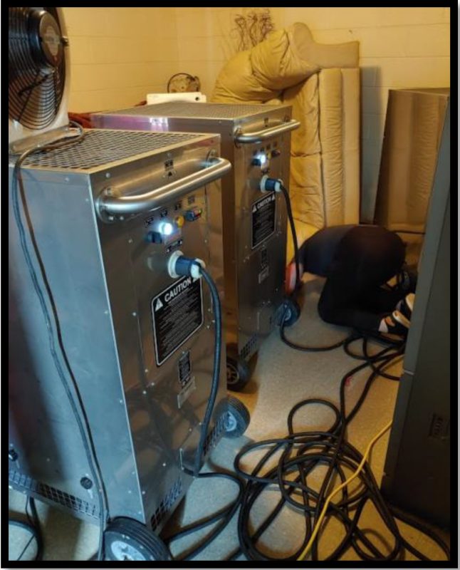 A large metal machine with wires that is a part of the TempAir system equipments